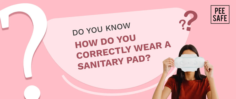 How do you correctly wear a sanitary pad?